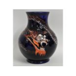 A Moocroft pottery Chinese dragon vase, marked WM