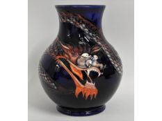 A Moocroft pottery Chinese dragon vase, marked WM