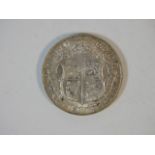 A 1914 George V silver half crown with lustre