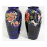 A pair of large Moorcroft pottery floral vases, bl
