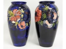 A pair of large Moorcroft pottery floral vases, bl