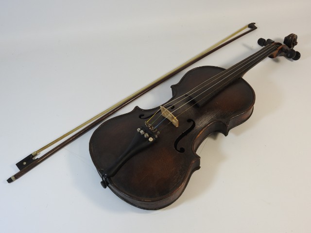 An antique violin, no maker mark, with bow & case,