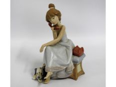 A Lladro porcelain figure of girl seated on phone