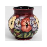 A Moorcroft pansy vase with yellow, lilac & red pa