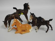 A collection of five Beswick foals, tallest 5in, P