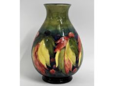 A Moorcroft pottery leaf & berry vase, blue signat