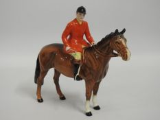 A Beswick huntsman on horse, huntsman head reglued