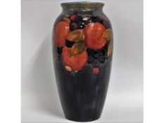 A Moorcroft pottery pomegranate vase, signed in bl