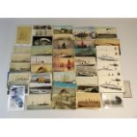 A quantity of vintage postcards of maritime & mili