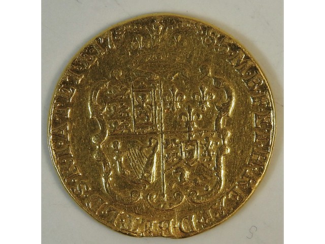 A 22ct gold George III 1785 guinea, 8.1g