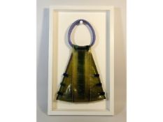 A Janice Myers recycled hand bag, mounted in frame