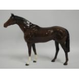 A Beswick racehorse, 14in long x 11.25in tall