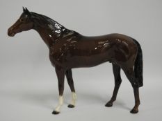 A Beswick racehorse, 14in long x 11.25in tall