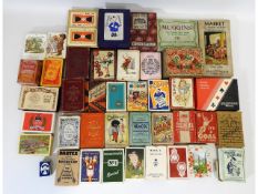 A quantity of vintage playing cards & card games i