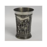 A German pewter ale beaker with heavy relief decor