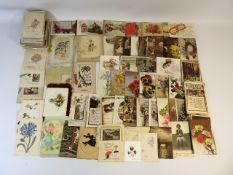 A quantity of vintage postcards including social h