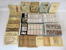 A quantity of cigarette cards, some dating from 18