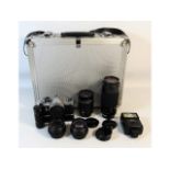 A Pentax MX 35mm film camera, a Takumr 135mm lens,