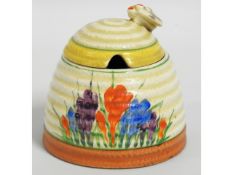 A Clarice Cliff Bizarre Crocus honey pot, 4in tall