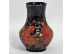 A Moorcroft pottery pomegranate vase, green signat