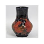 A Moorcroft pottery pomegranate vase, green signat