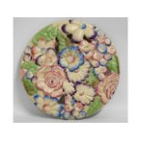 A Clarice Cliff floral wall plaque, 13.25in diamet