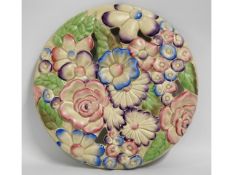 A Clarice Cliff floral wall plaque, 13.25in diamet