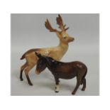 A Beswick stag, 8in tall, twinned with a Beswick d