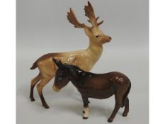 A Beswick stag, 8in tall, twinned with a Beswick d