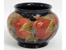 A Moorcroft pottery pomegranate vase, green signat