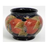 A Moorcroft pottery pomegranate vase, green signat