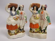 A pair of 19thC. Staffordshire figures, 13.25in ta