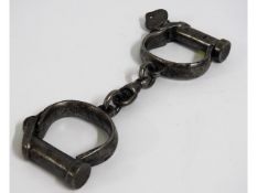 A WW2 set of military handcuffs with broad arrow m