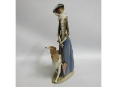A Lladro porcelain figure of a woman with Afghan h