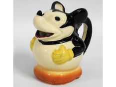 An early/mid 20thC. Mickey Mouse jug, 4.25in tall