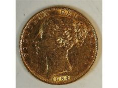 A Victorian 1864 shield back full gold sovereign,