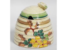 A Clarice Cliff Bizarre honey pot, 4in tall