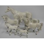 A family of six Beswick grey horses, largest 13.75