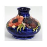 A Moorcroft pottery vase with floral decor, signed