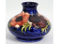 A Moorcroft pottery vase with floral decor, signed