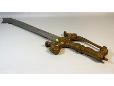 A reproduction Saudi beheading sword with brass ha