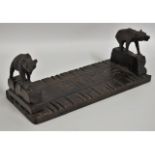 A Black Forest carved oak extending book stand wit