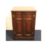 An oak entertainment cabinet, 35.5in high x 25in w