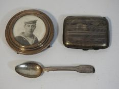 A silver tea spoon, silver cigarette case & a silv