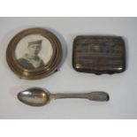 A silver tea spoon, silver cigarette case & a silv