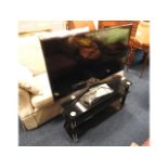 A Samsung 6 series 50in flat screen television wit