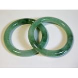 A pair of Chinese jade bangles, internal diameter