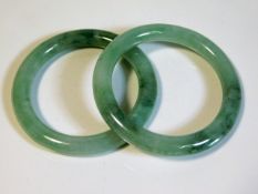 A pair of Chinese jade bangles, internal diameter