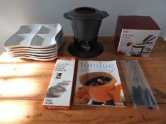 An unused Le Creuset fondue set