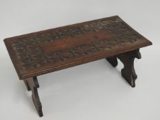 A small, low level table, 20in wide x 10.5in deep